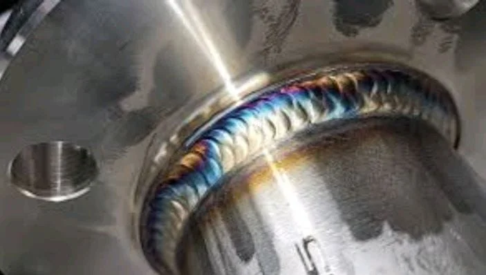 Close-up aluminium weld with controlled heat colour